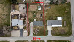 Aerial perspective of suburban area with property boundaries highlighted