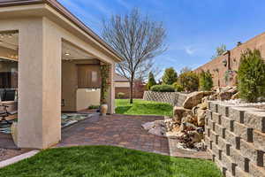 Fenced backyard with a patio