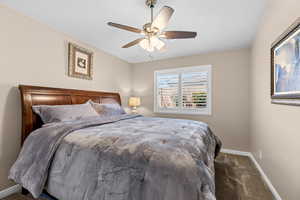 Bedroom featuring carpet floors and ceiling fan