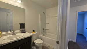 Full bath with vanity and shower / tub combination