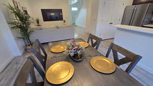 Dining room with light wood-style flooring