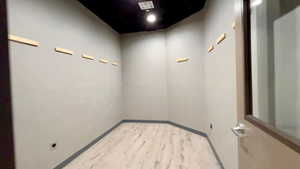 Unfurnished room featuring light wood-style floors and baseboards