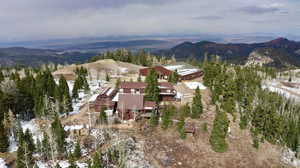 Snowy aerial view featuring a mountain view