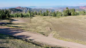 View of mountain background featuring rural landscape