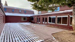 Wooden deck featuring french doors