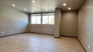 Unfurnished room featuring light wood-type flooring and recessed lighting
