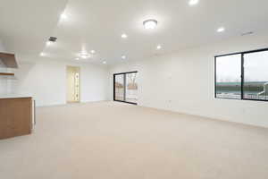 Unfurnished room featuring light colored carpet and recessed lighting