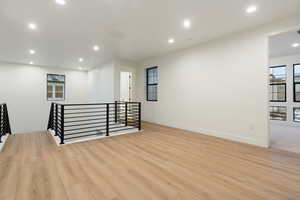 Empty room featuring recessed lighting and light wood finished floors
