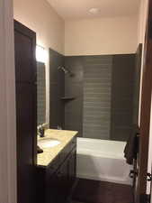 Bathroom featuring vanity and tub / shower combination