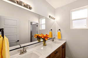 Full bath with double vanity and curtained shower