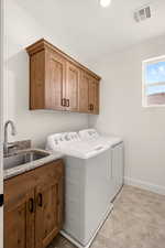 Laundry area with washer and dryer and cabinet space