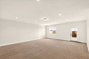 Empty room featuring carpet and recessed lighting