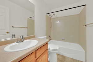 Bathroom featuring vanity and shower / washtub combination