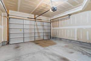 Garage featuring a garage door opener