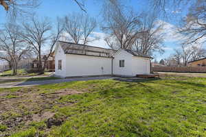 Back of house with a patio area and board and batten siding