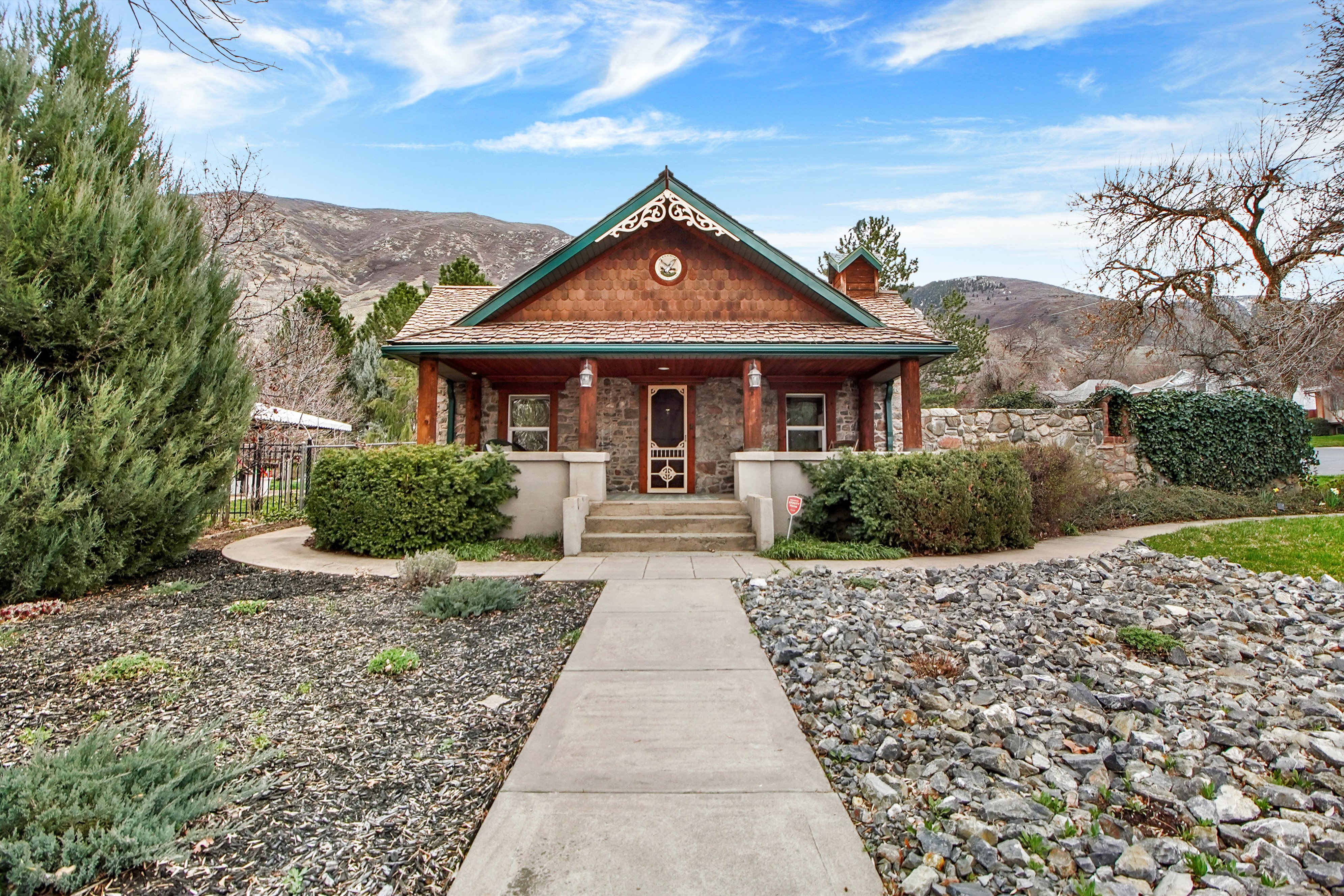 View of front of home with a porch and a mountain view