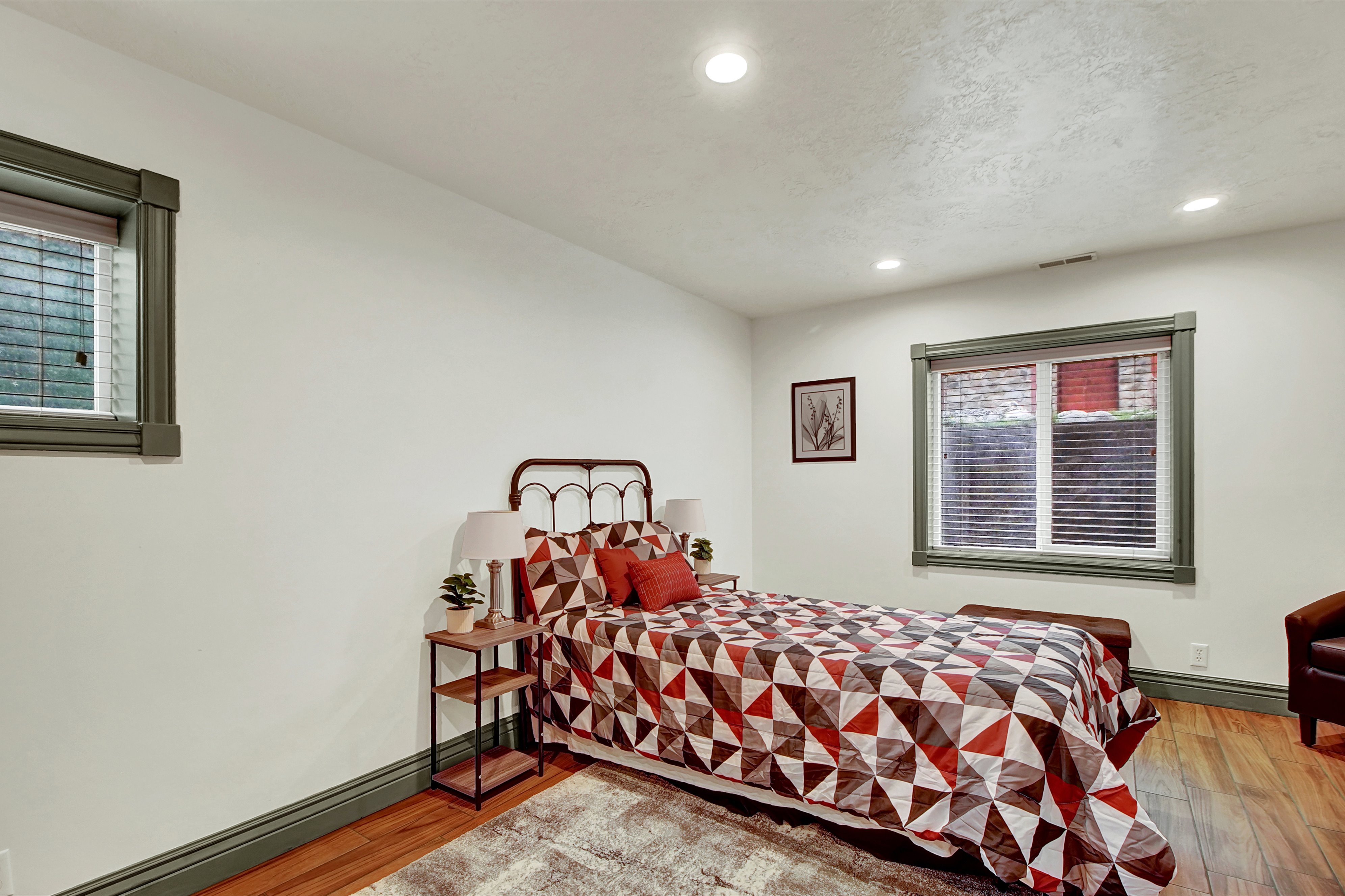 Bedroom featuring light wood-style flooring, recessed lighting, and a baseboard heating unit