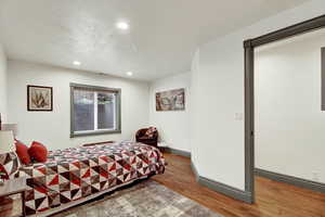 Bedroom featuring wood finished floors and recessed lighting