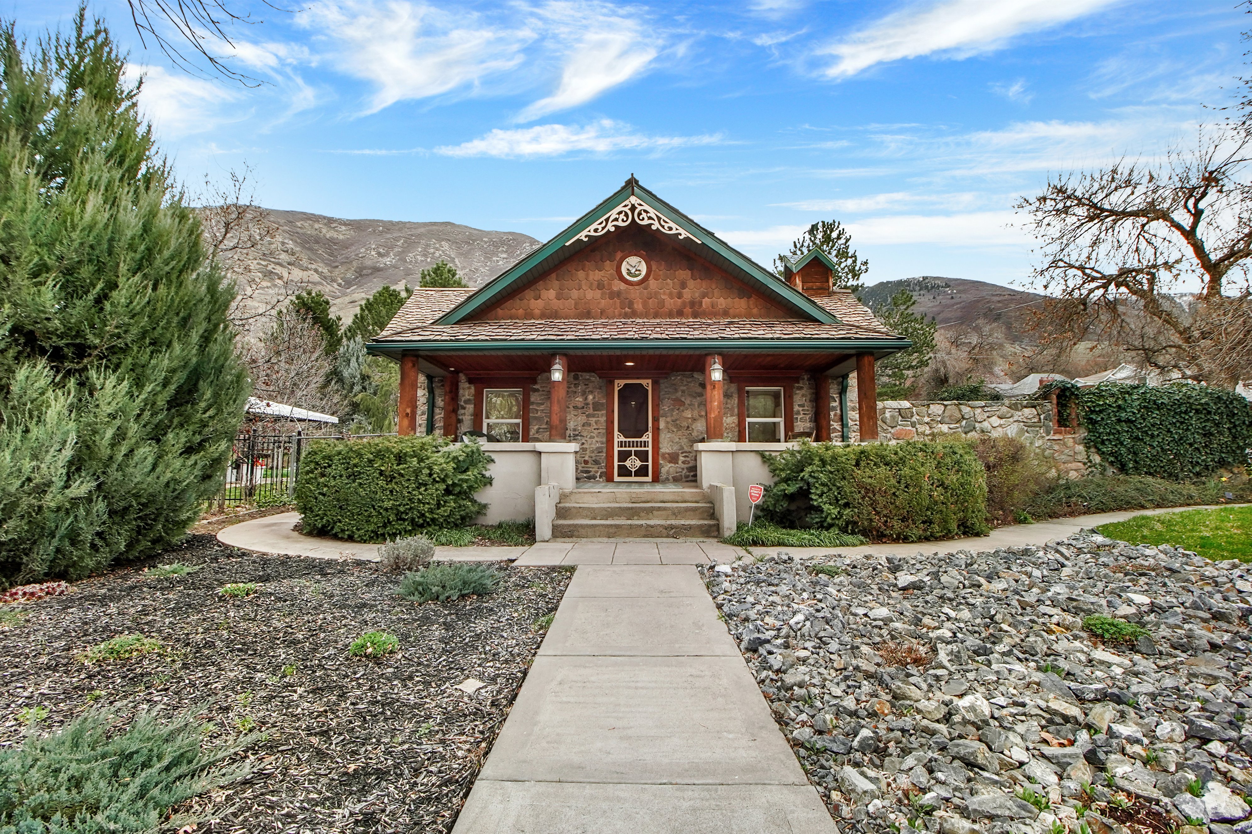 View of front of property featuring covered porch and a mountain view