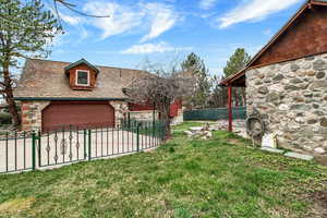 View of yard featuring a garage