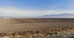 View of mountain background with rural landscape and farmland