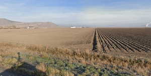 View of mountain background with rural landscape and extensive farmland