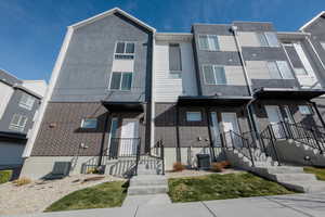 Contemporary house featuring brick siding