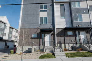 View of front of home featuring brick siding