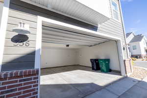 Garage featuring driveway