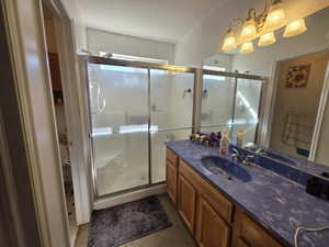 Bathroom with vanity and a stall shower