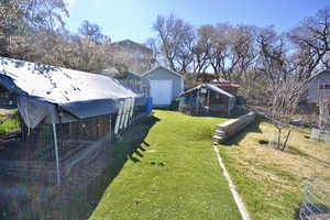 View of yard featuring an outdoor structure