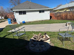 View of yard featuring a fire pit and a patio area