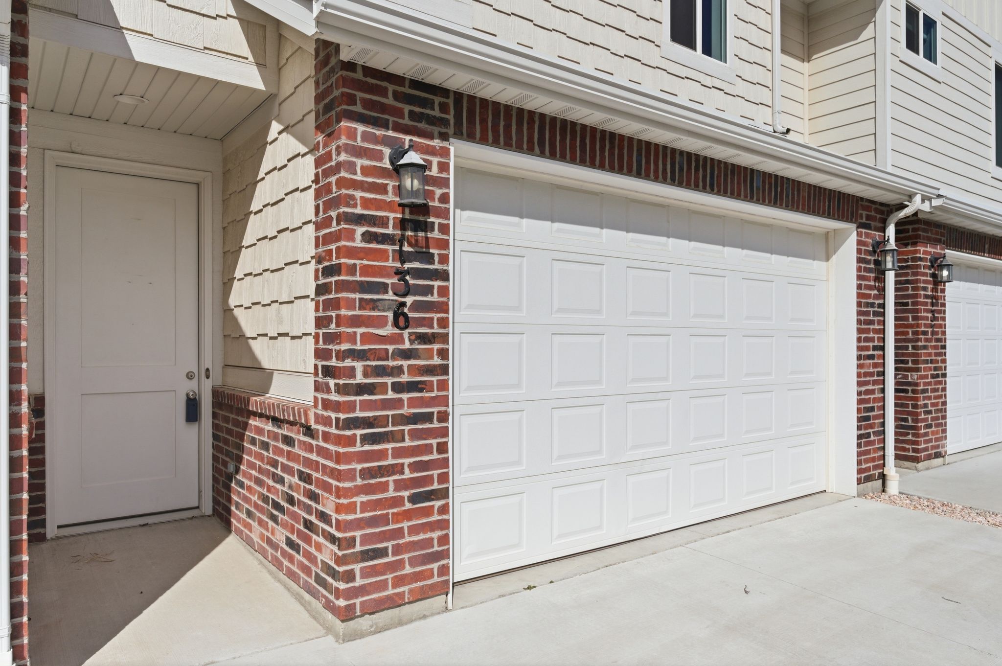 Garage featuring concrete driveway