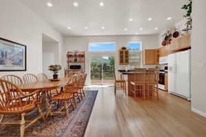 Dining area featuring light wood-style flooring and recessed lighting