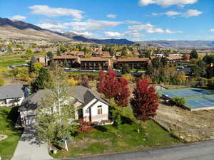 Aerial view of residential area featuring a mountainous background
