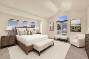 Bedroom with light colored carpet and baseboards