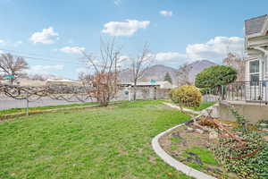 Fenced backyard with a mountain view