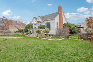Bungalow-style home with a chimney and a shingled roof