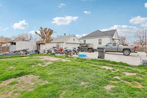 View of yard with detached garage and shed