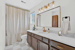 Bathroom with vanity and shower / bath combo