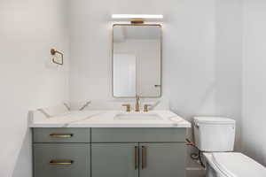 Bathroom featuring toilet and vanity