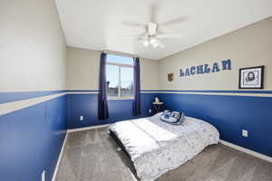 Bedroom with ceiling fan and carpet