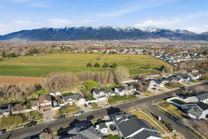 Aerial view of residential area featuring a mountainous background