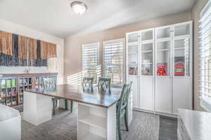 Office with plenty of natural light and dark wood-style flooring