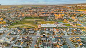 Aerial view of property's location with nearby suburban area and mountains