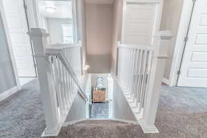 Staircase with carpet floors
