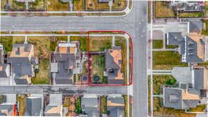 Aerial view of residential area featuring property boundaries highlighted