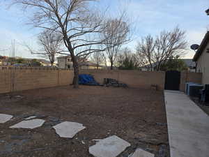 Fenced backyard with a gate