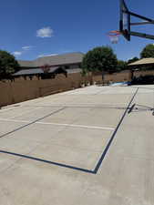 View of basketball court with community basketball court and a patio