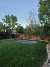 Fenced backyard with a patio area